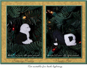 Old English Sheepdog puppy ornaments on tree.